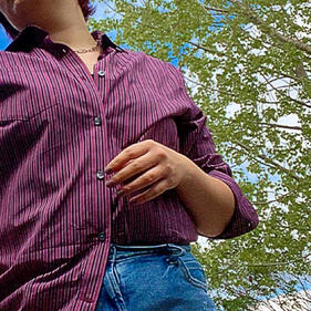 an image of the valkyrie character from marvel with a green background behind her.